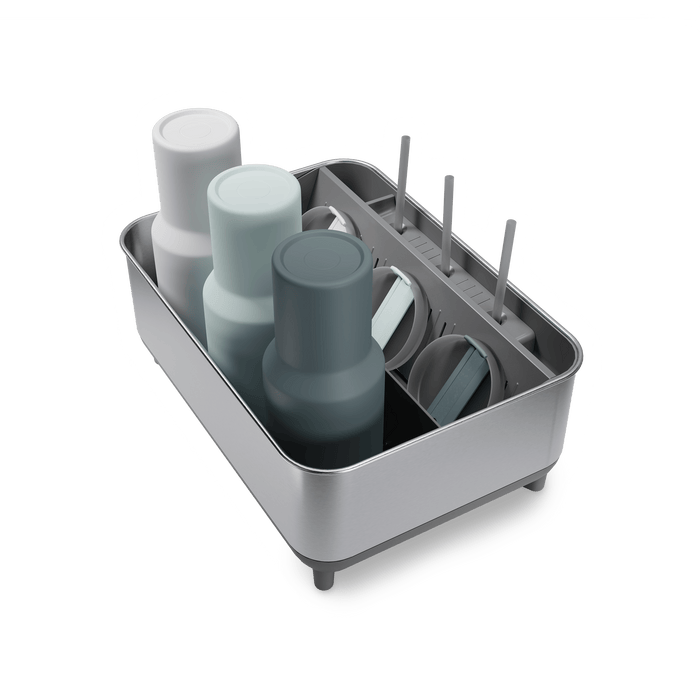 Simplehuman Brushed stainless steel Bottle Dock holding reusable bottles, straws, and lids.